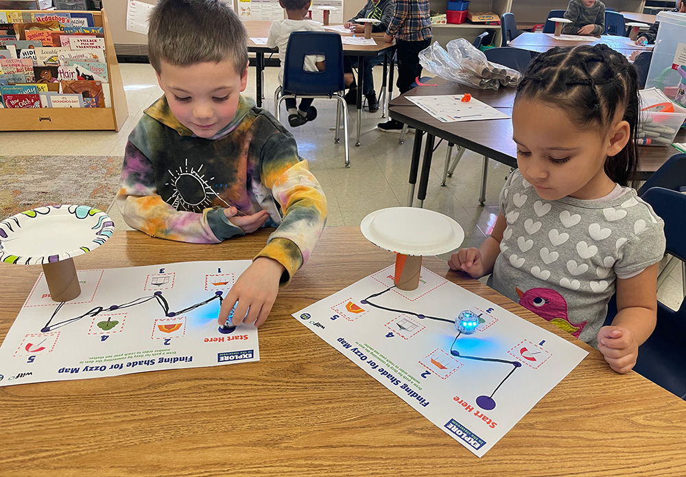 Two children playing a learning game